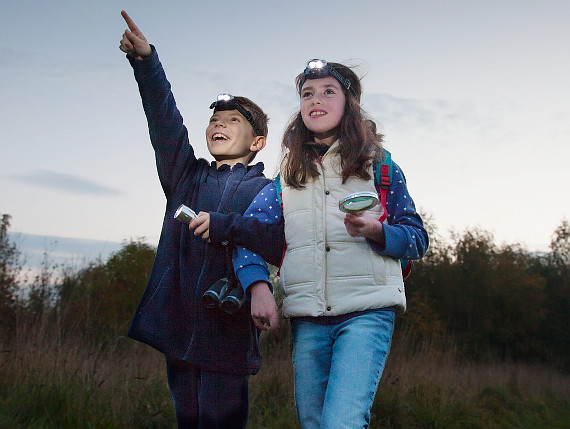 Boy and girl bat watching at night in Heartwood Forest