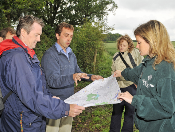 Group of ramblers with map in Heartwood Forest